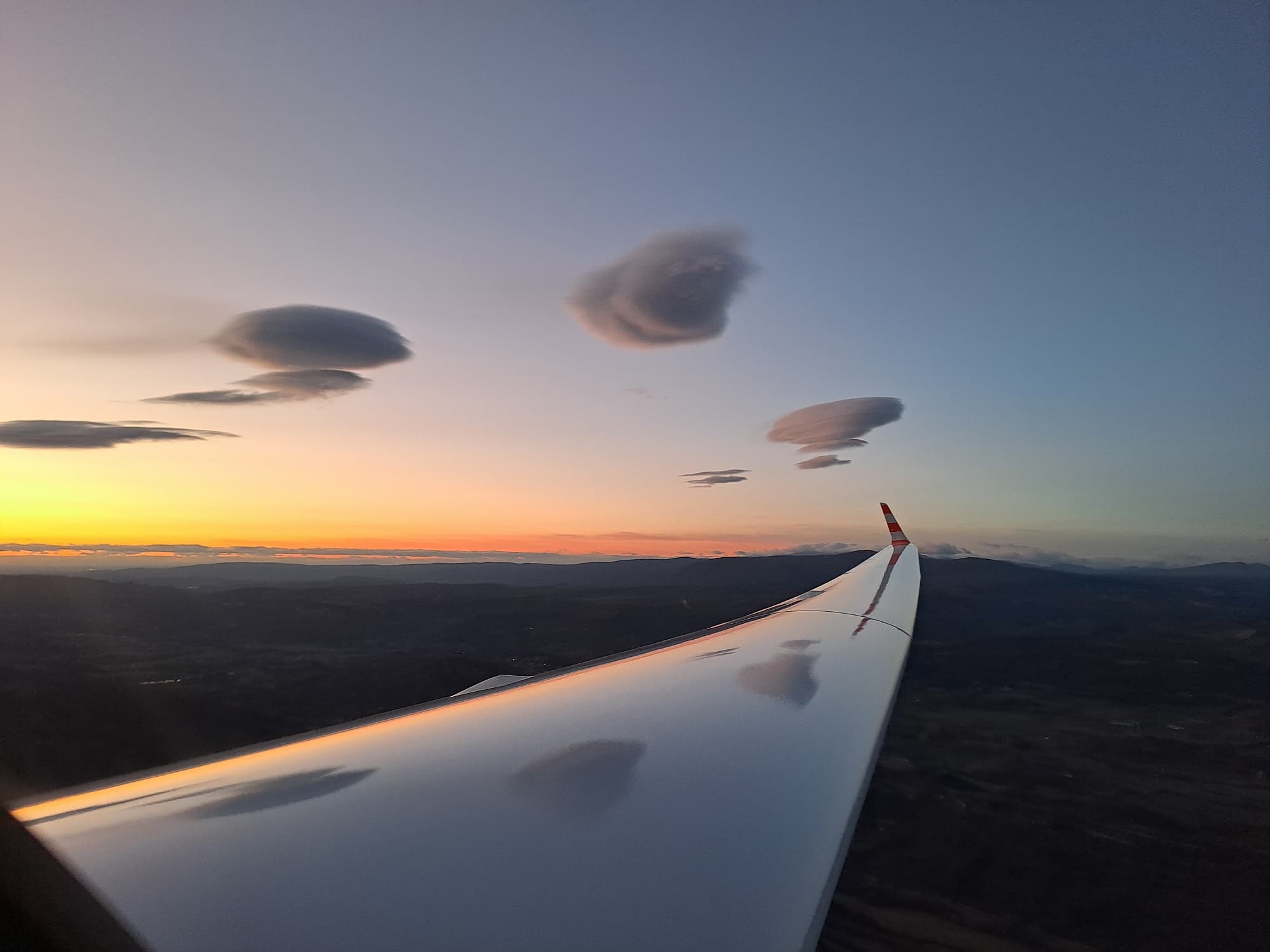 Wave-riding flight at sunset